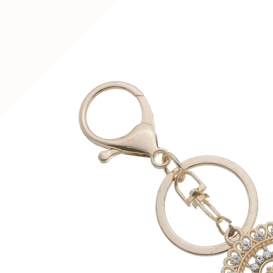 Chaveiro de Nossa Senhora Aparecida em Metal com Strass e Mosquete - Dourado