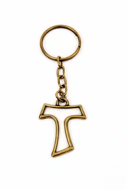 Chaveiro de Tau Vazada em Metal - Ouro Velho